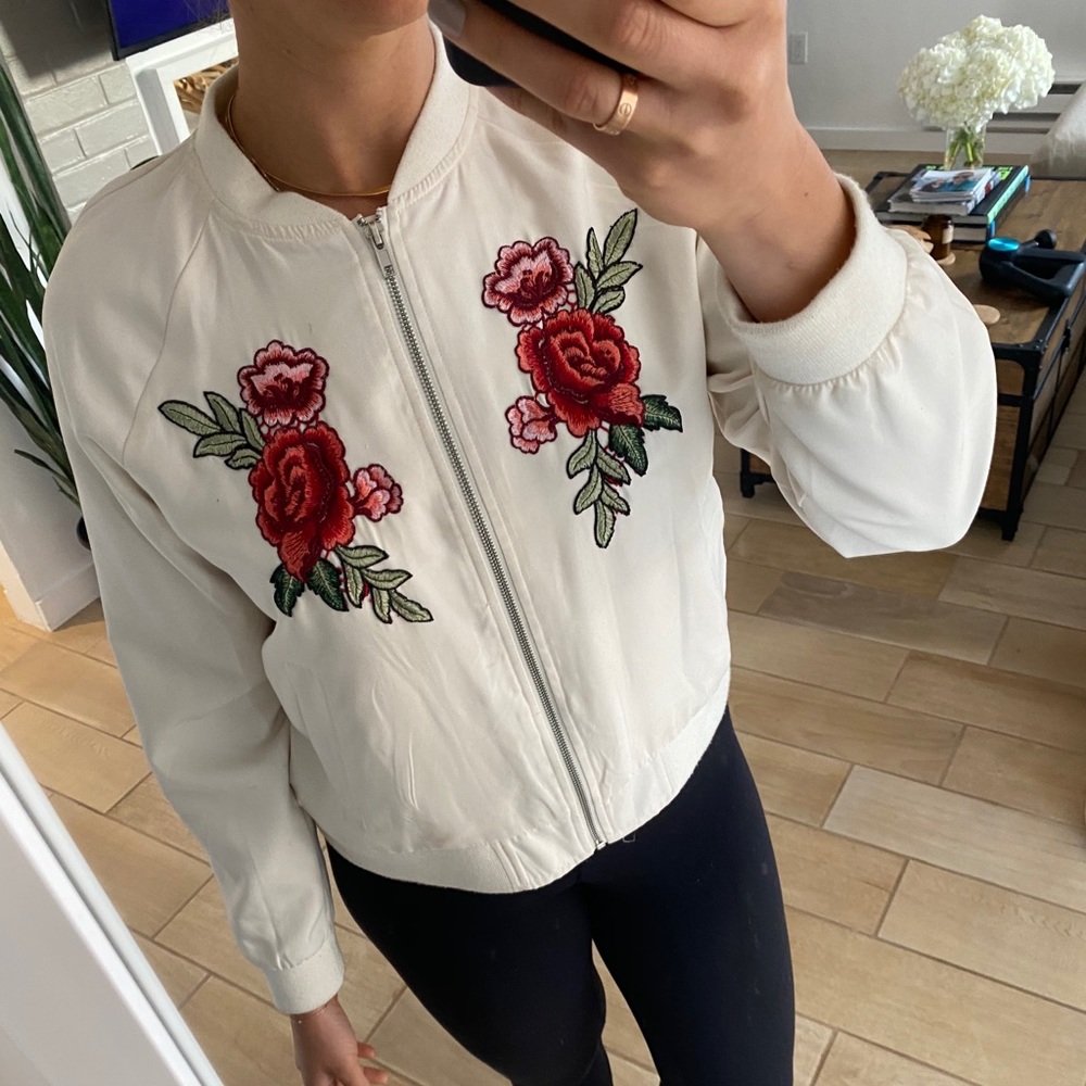 White/cream bomber with flower appliqué detail